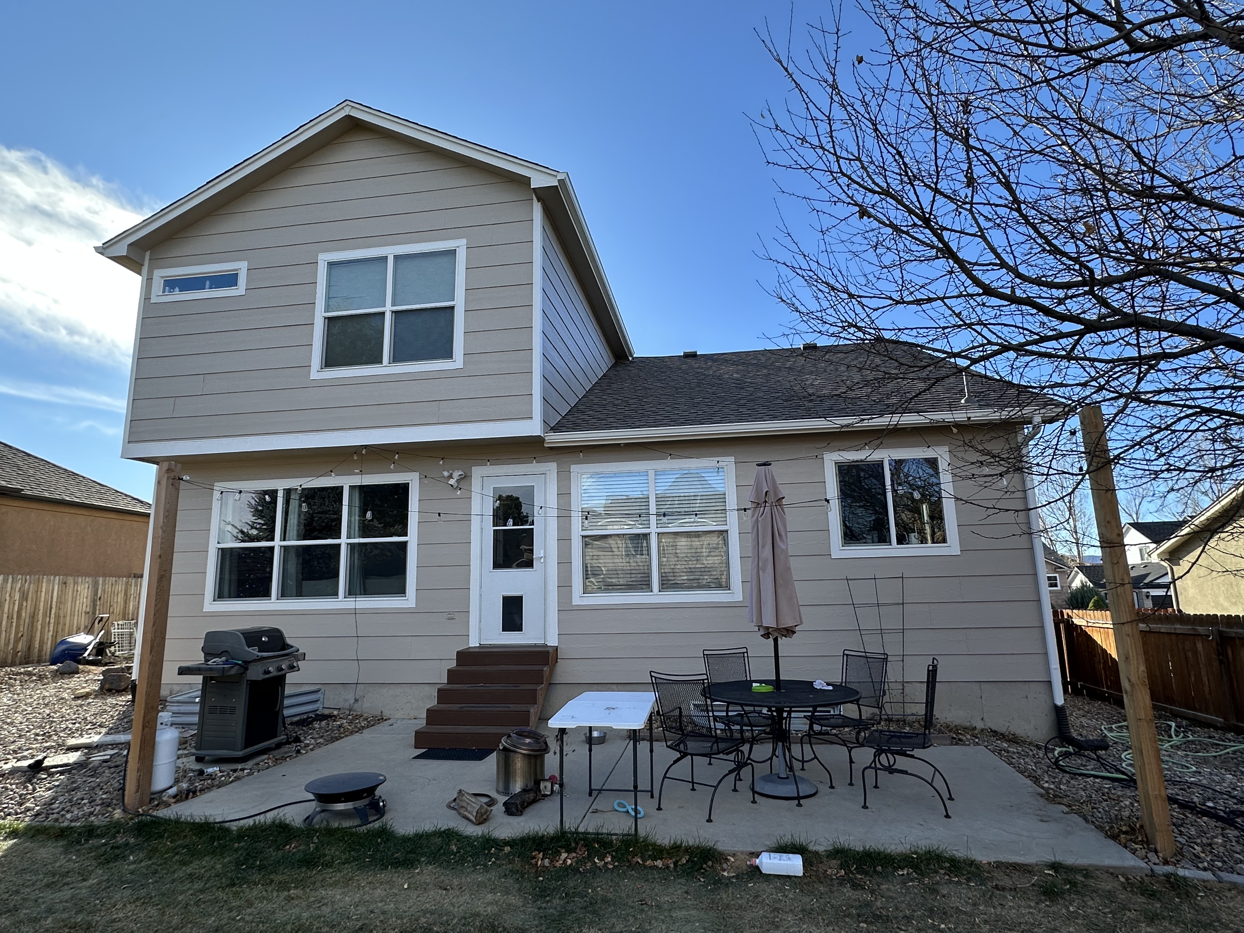 Gray Siding House - Backyard View Complete